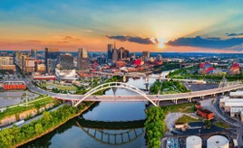 Skyline of Nashville, Tennessee at sunset, showcasing the city's vibrant growth and thriving business scene.